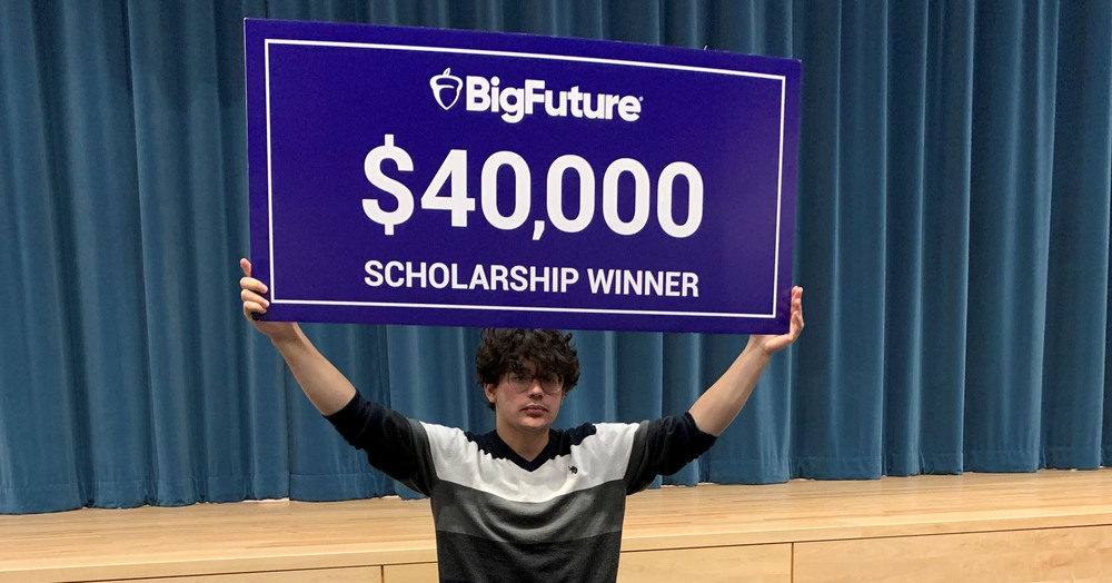 student holding sign