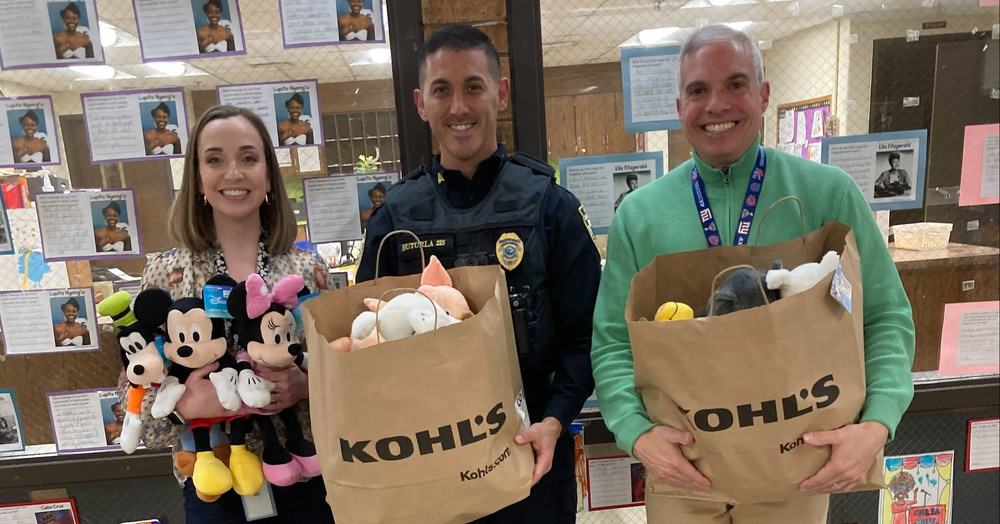 staff and whpd posing with stuffed animals
