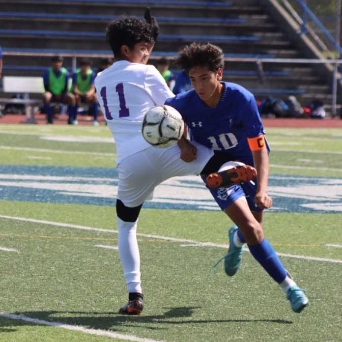 student playing soccer