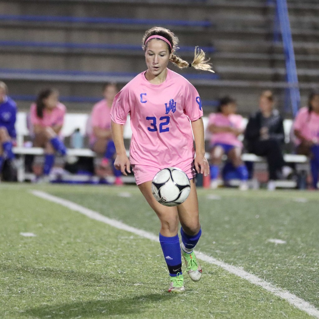 student playing soccer