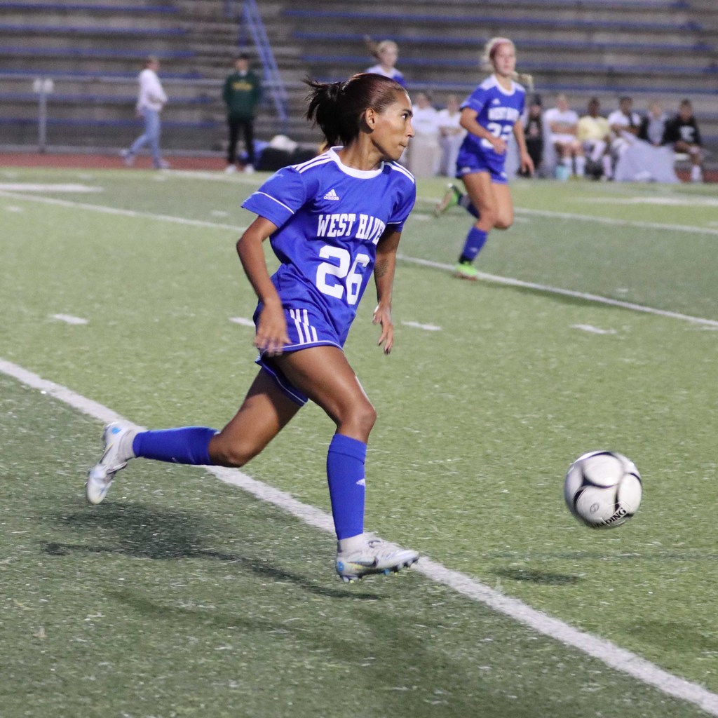 student playing soccer