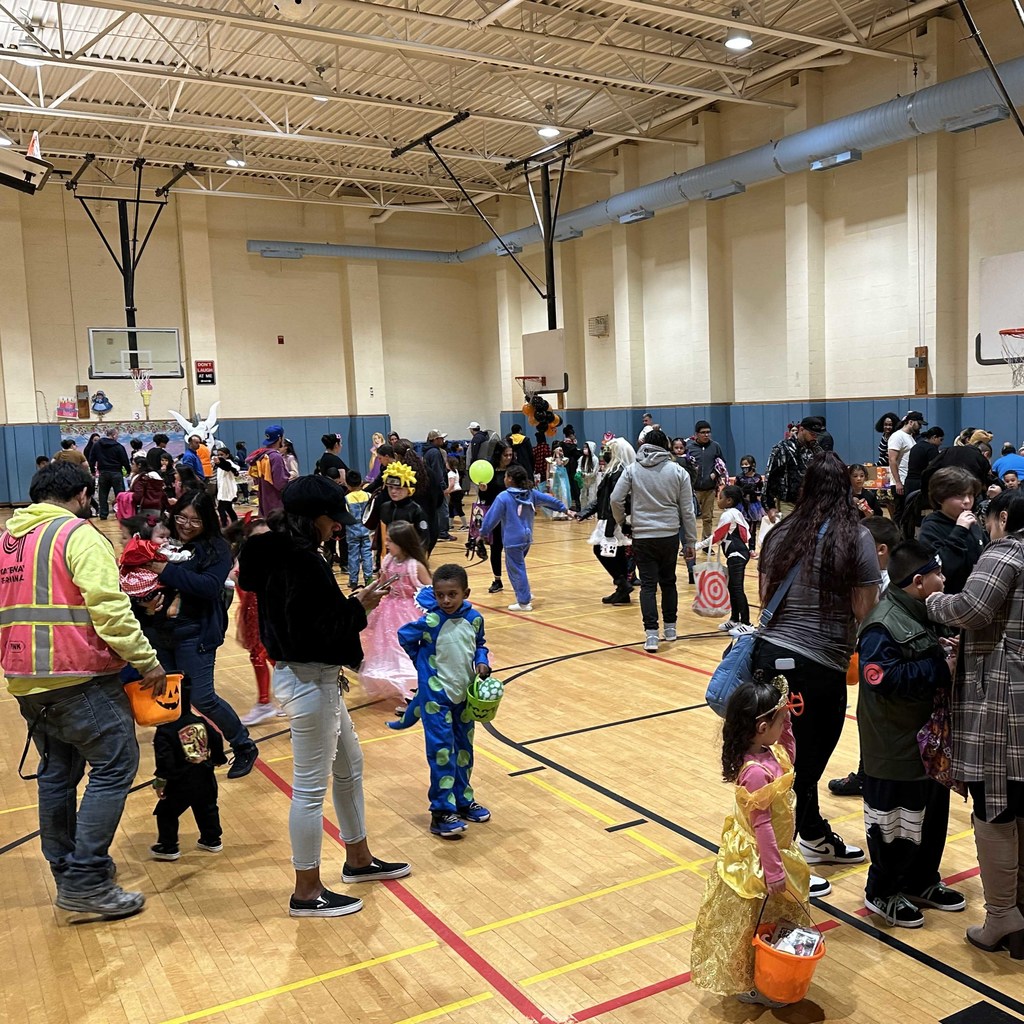 students and families in a gym