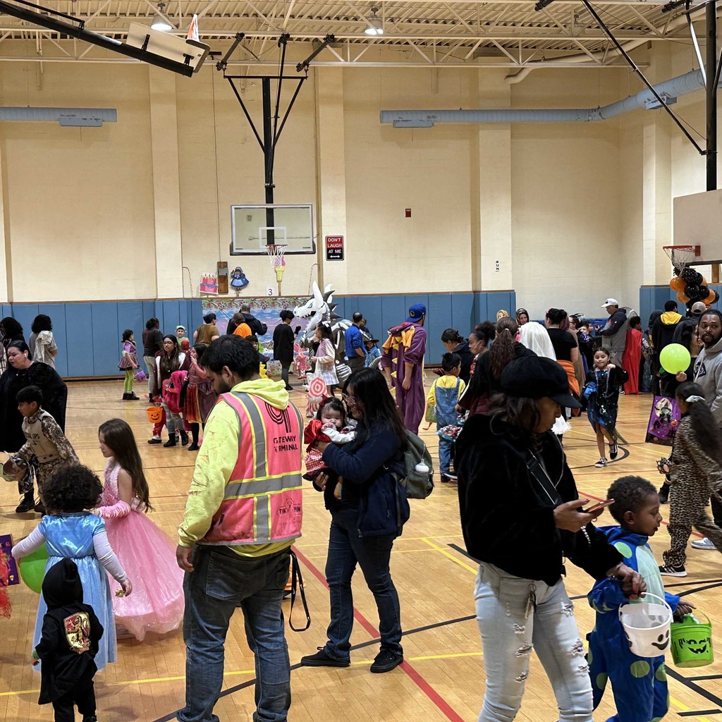 students and families in a gym