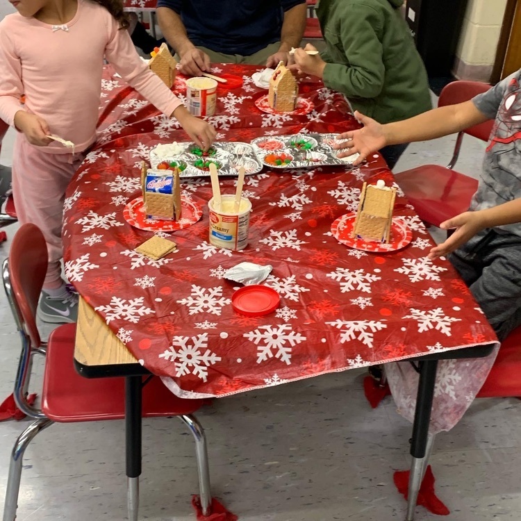 students building gingerbread houses