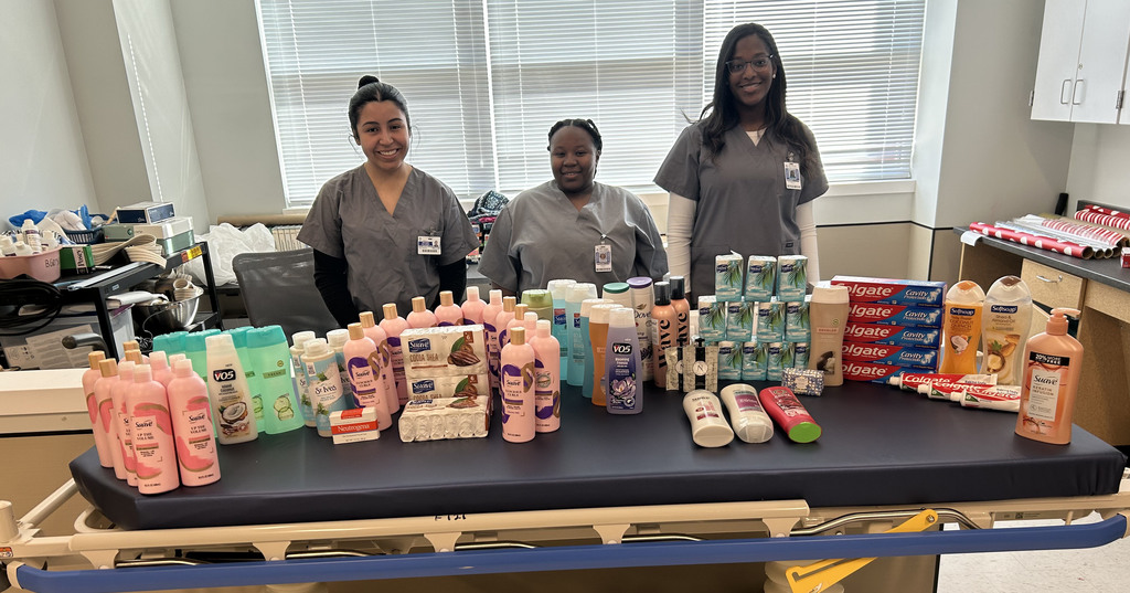 students posing with health and beauty products
